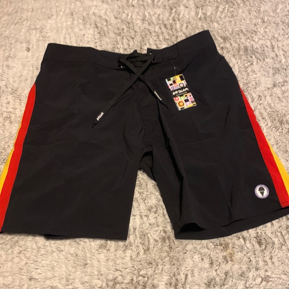Nice board shorts/swim suit.
